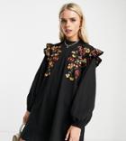 Asos Design Petite Mini Swing Dress With Shoulder Ruffle And Daisy Embroidery In Black