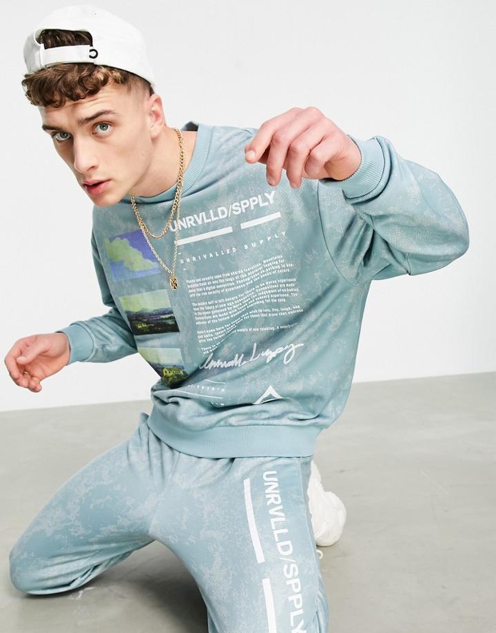 Asos Unrvlld Spply Coordinating Relaxed Sweatpants With All-over Wash And Logo Leg Print In Blue-blues