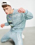 Asos Unrvlld Spply Coordinating Relaxed Sweatpants With All-over Wash And Logo Leg Print In Blue-blues