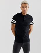 Asos Design Organic Polo Shirt With Contrast Sleeve Stripe In Black