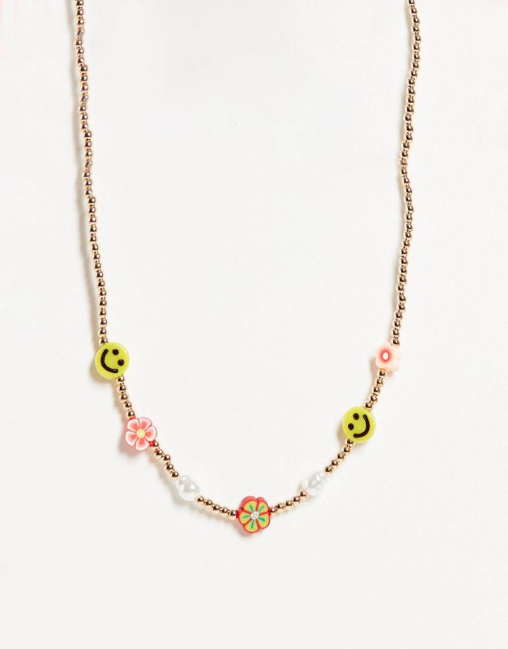 Asos Design Necklace With Flower And Happy Face Beads In Gold Tone