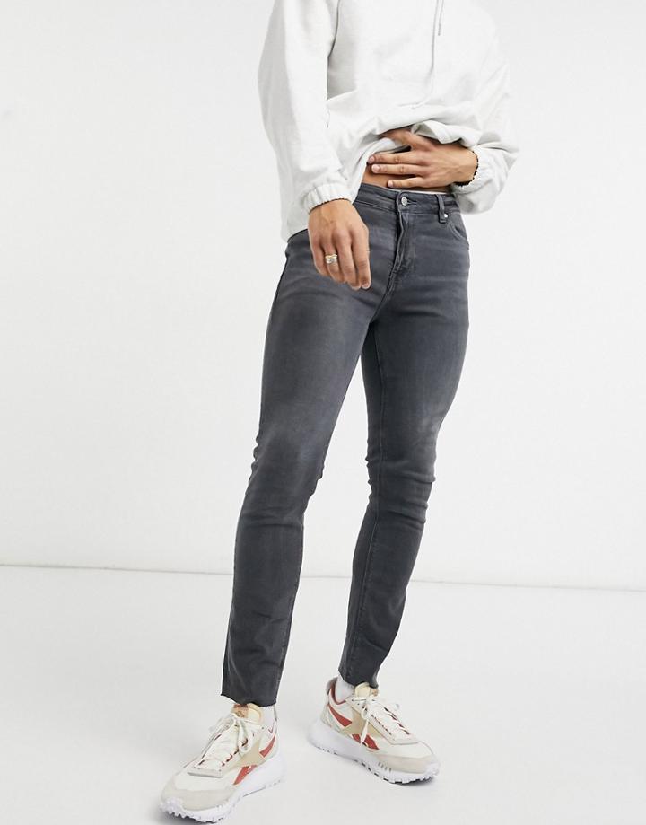 Asos Design Skinny Jeans In Washed Black With Raw Hem