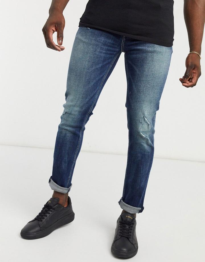 Asos Design Skinny Jean In Dark Blue Vintage Japanese Wash With Abrasions