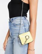Truffle Collection Mini Cross Body With Ring And Chain Detail In Yellow
