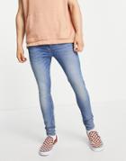 Asos Design Spray On Jeans With Power Stretch In Mid Wash Blue