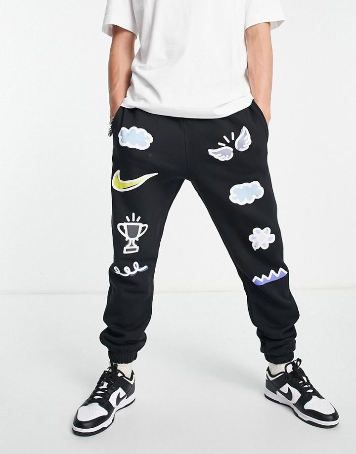 Nike Doodleglyph Graphic Cuffed Sweatpants In Black