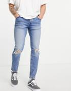Asos Design Organic Cotton Blend Skinny Jeans In Light Wash Blue With Knee Rip-blues