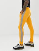 Asos Design Skinny Sweatpants In Poly Tricot With Side Stripe In Yellow - Yellow