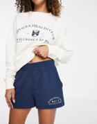 Asos Design Tracksuit Sweat / Roll Waist Sweat Short With Riviera Graphic In Navy/cream-multi