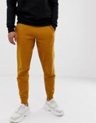 Asos Design Tapered Sweatpants In Mustard-yellow