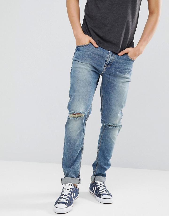 Asos Design Skinny Jeans In Mid Wash With Knee Rips - Blue