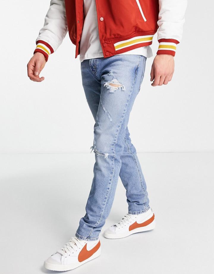 Levi's 512 Slim Taper Lo Ball Jeans In Light Blue Wash With Rips