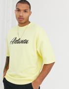 Asos Design Oversized Short Sleeve Sweatshirt In Yellow With Atlanta Print