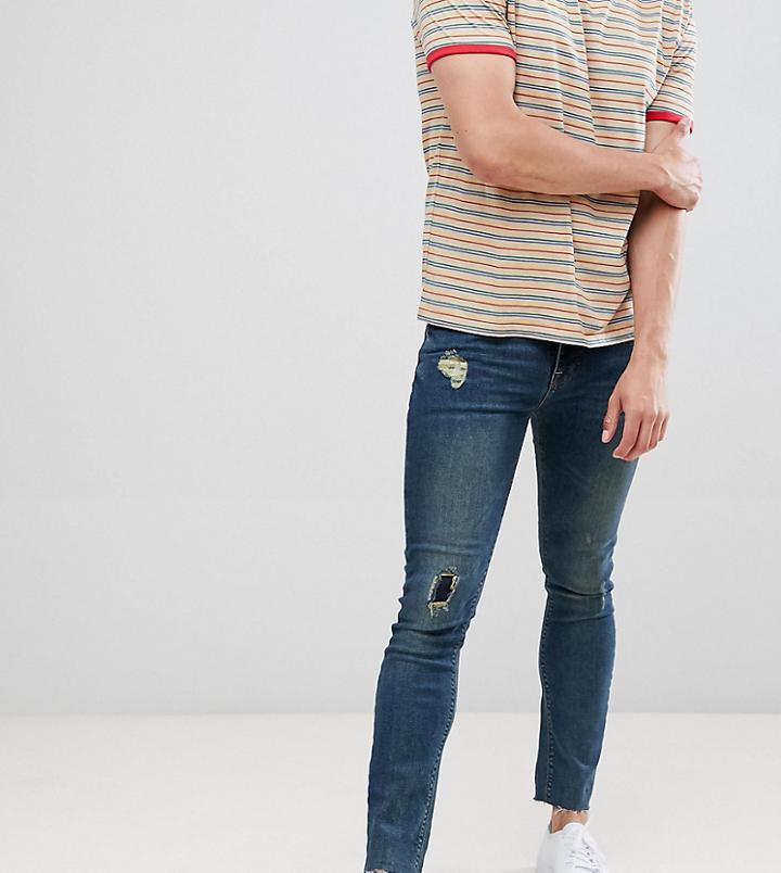 Asos Design Super Skinny Jeans In Dark Blue Wash With Rip And Repair - Blue