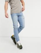 Asos Design Skinny Jeans In Vintage Light Wash With Rips-blue