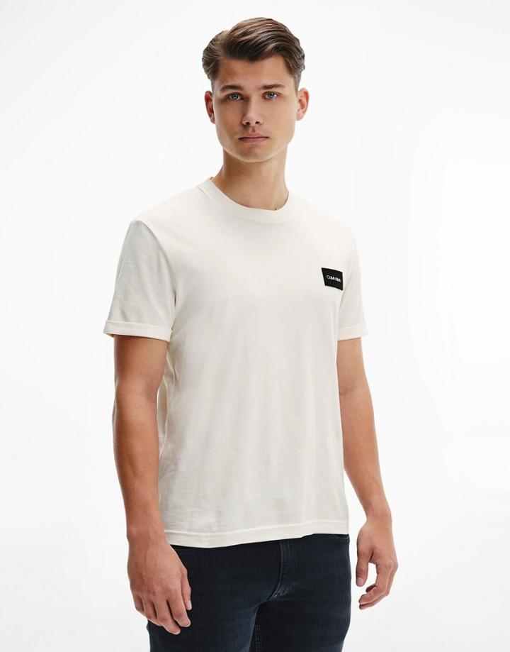 Calvin Klein Turn-up Sleeve Badge Logo T-shirt In Cream-white