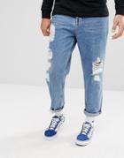 Asos Skater Jeans In Vintage Mid Wash Blue With Heavy Rips