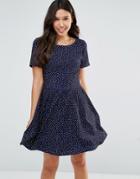 Yumi Short Sleeve Tie Back Dress In Polka Dot - Navy