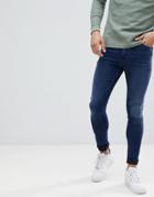 Asos Design Super Spray On Jeans In Dark Wash Blue - Blue