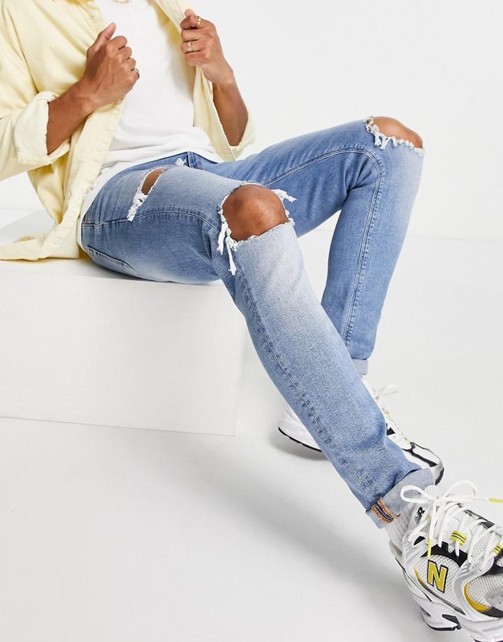 Asos Design Skinny Jeans In Light Wash Blue With Heavy Rips-blues