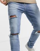 Asos Design Extra Stretch Skinny Jeans In Vintage Light Wash With Heavy Rips-blues