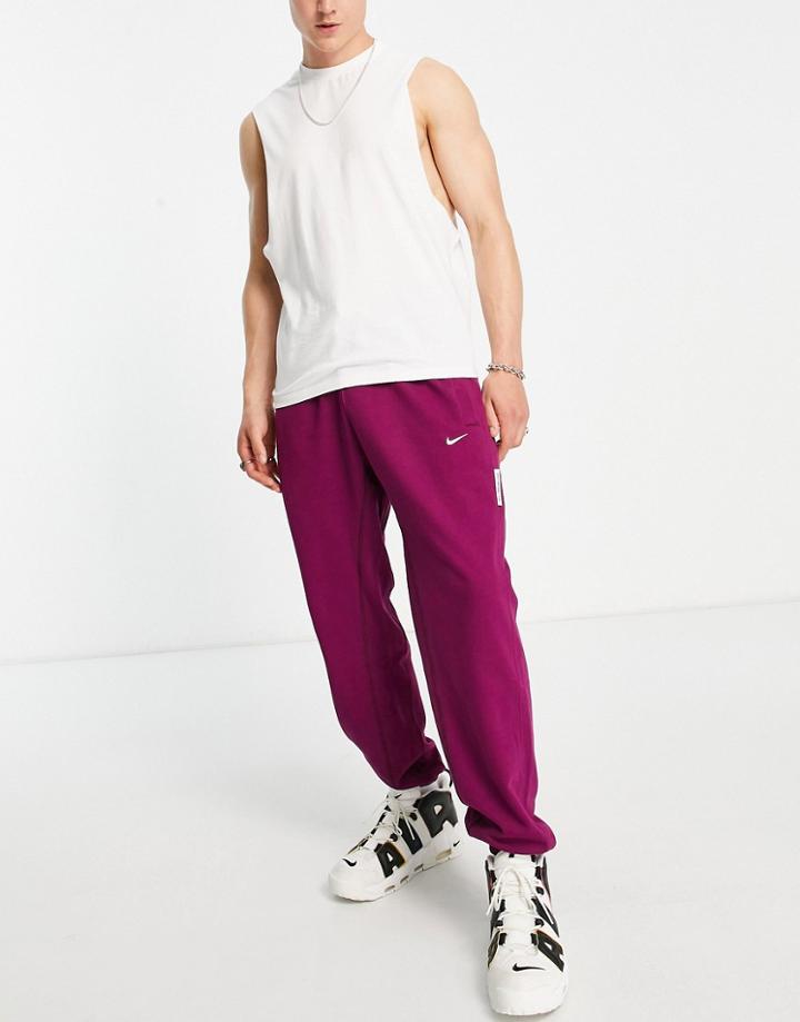 Nike Basketball Dri-fit Standard Issue Cuffed Sweatpants In Burgundy-red