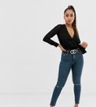 Asos Design Petite Ridley High Waisted Skinny Jeans In Dark Wash Blue With Ripped Knee Detail