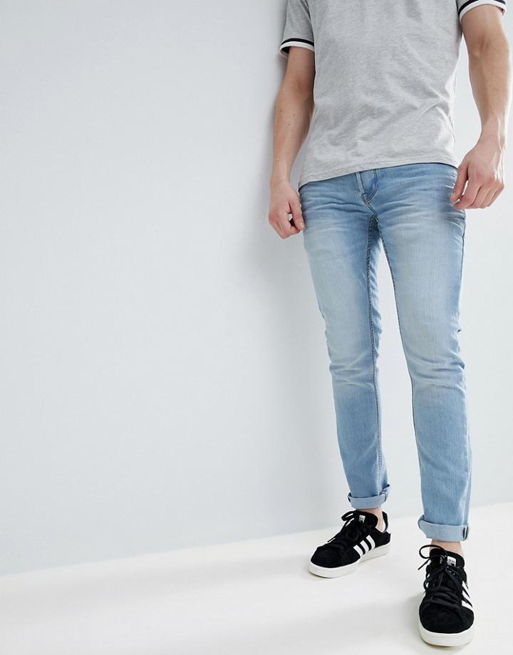 Solid Slim Stretch Jean In Bleach Wash - Blue