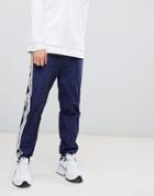 Mennace Joggers With Side Logo In Navy - Navy