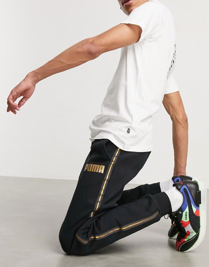 Puma Sweatpants In Black With Gold Taping