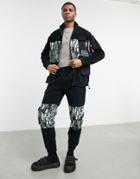 Asos Design Set Polar Fleece Tapered Sweatpants With Abstract Camo Panels & Utility Pockets In Black