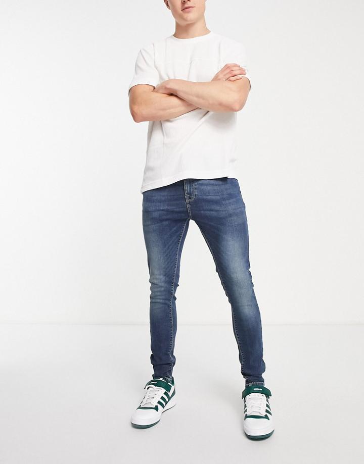 Asos Design Spray On Jeans With Power Stretch In Dark Wash Blue