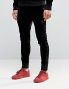 Religion Jersey Joggers In Slim Fit With Metal Badge And Zip Cuff - Black