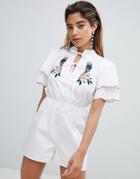 Fashion Union Tea Romper With Tie Neck And Parrot Embroidery - White