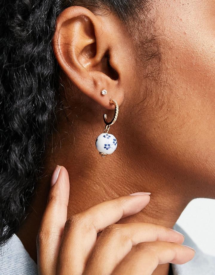 Topshop Beaded Ceramic Drop Huggy Hoop Earrings In Gold And Blue