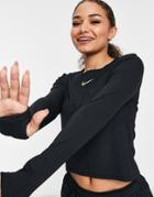 Nike Running Icon Clash Gold Logo Long Sleeve Top In Black