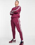 Adidas Originals Adicolor Three Stripe Sweatpants In Plum-red