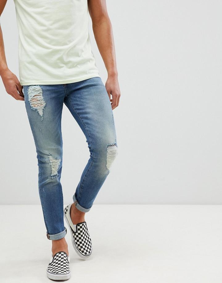 Asos Design 12.5oz Skinny Jeans In Mid Wash Blue With Heavy Rips