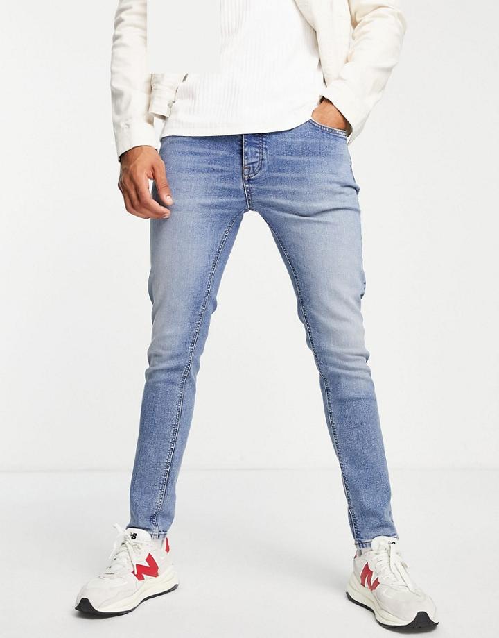 Asos Design Cotton Blend Skinny Jeans In Tinted Light Wash - Lblue-blues