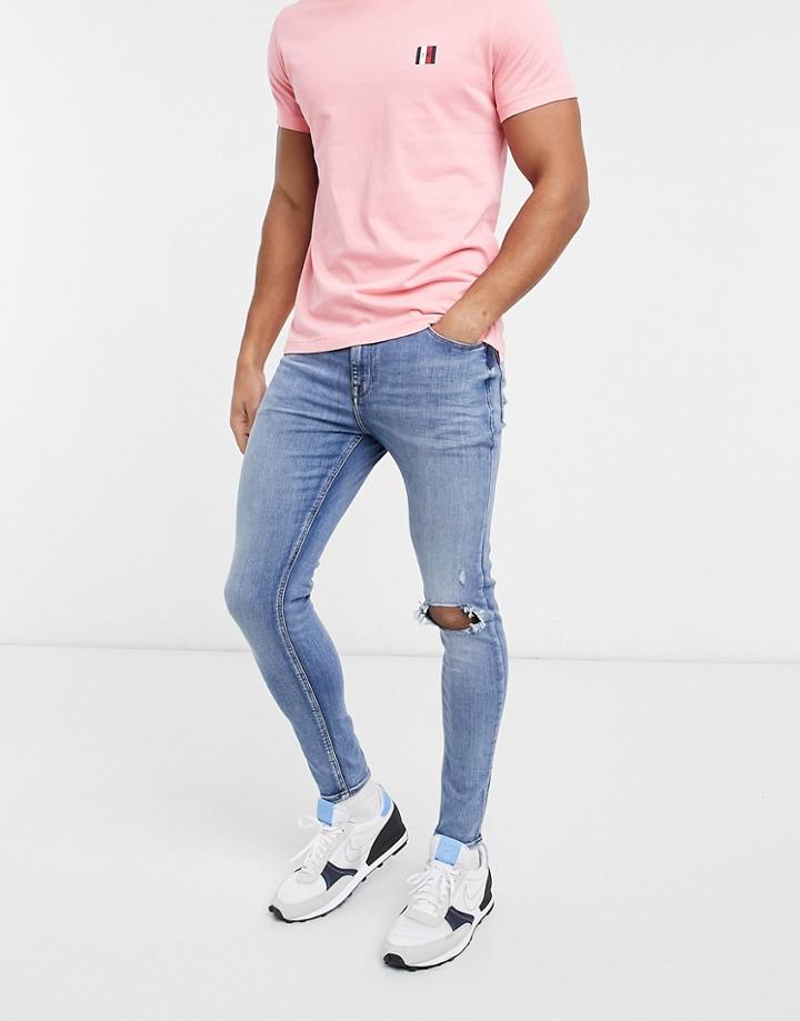 Asos Design Spray On Jeans With Power Stretch In Mid Wash Blue With Knee Rips-blues