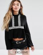 Young Bohemians High Neck Top With Wide Sleeves And Pom Pom Trim - Black
