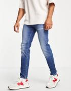 Asos Design Organic Cotton Blend Skinny Jeans In Dark Wash Blue With Destroyed Hem-blues