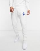 Nike World Tour Pack Graphic Cuffed Sweatpants In White