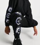 Asos Unrvlld Spply Oversized Sweatpants With Woven Tab And Graphic Print In Black - Part Of A Set