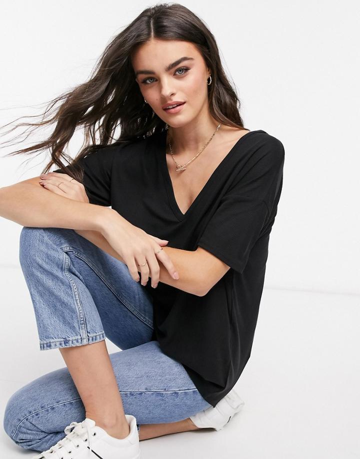 Asos Design Oversized V Neck Top With Curved Hem In Clean Rib In Black