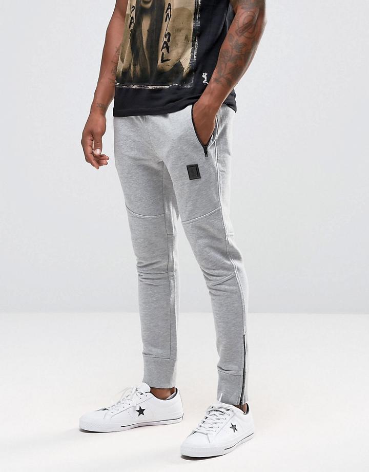 Religion Jersey Joggers In Slim Fit With Metal Badge And Zip Cuff - Gray