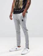 Religion Jersey Joggers In Slim Fit With Metal Badge And Zip Cuff - Gray