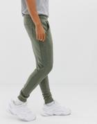 Asos Design Skinny Sweatpants With Ribbed Side Stripe And Acid Wash-green