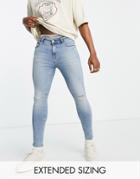 Asos Design Spray On Jeans With Power Stretch In Light Wash Blue With Abrasions