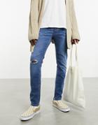 Asos Design 'responsible Edit' Skinny Jeans In Mid Wash With Rips-blue
